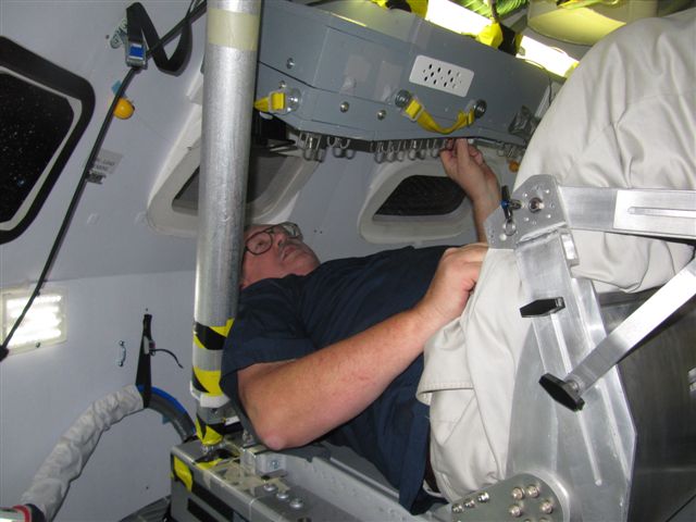 Jim in Orion capsule trainer crew seat